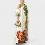 Skylar - Robe maxi à imprimé floral, décolleté asymétrique et manches bouffantes