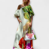 Skylar - Robe maxi à imprimé floral, décolleté asymétrique et manches bouffantes