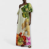 Skylar - Robe maxi à imprimé floral, décolleté asymétrique et manches bouffantes