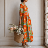 Coralie™ | Robe longue à grands motifs floraux naïfs et fond contrasté