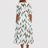 Adelina | Kleid mit Blumen-Zweigen-Print und A-Linie