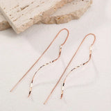 Boucles d'oreilles longues avec design ondulé