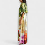 Skylar - Robe maxi à imprimé floral, décolleté asymétrique et manches bouffantes